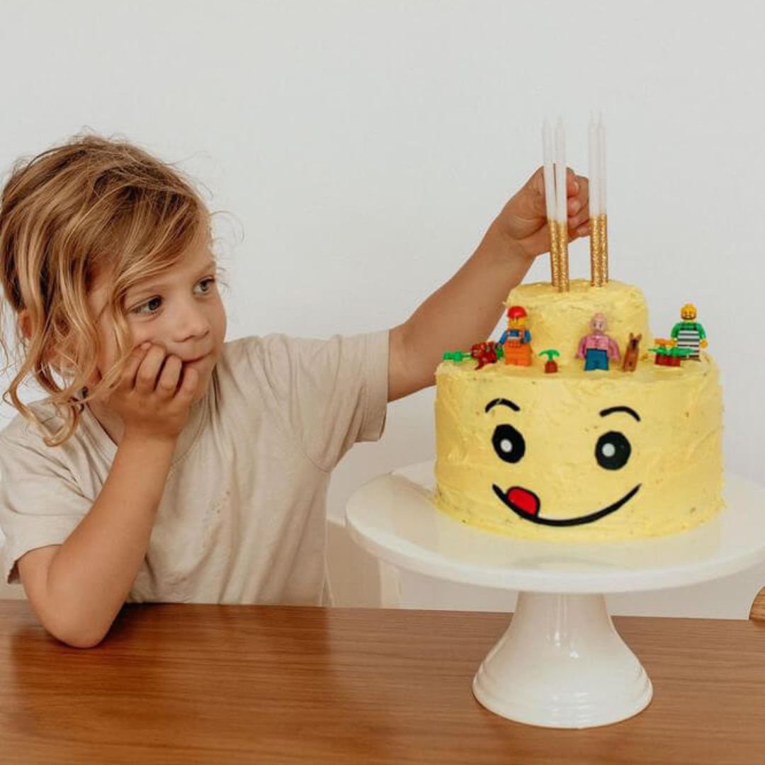 Lego Head Cake - Decorated Cake by Magical Cakes - CakesDecor